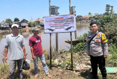 Polsek Jejawi Peringatkan Warga Sukadarma Soal Ancaman Buaya dengan Pemasangan Spanduk Imbauan