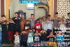 Sapa Ramadan dengan Kebaikan, Polsek Babat Toman Bagikan Puluhan Alquran di Desa Ulak Teberau